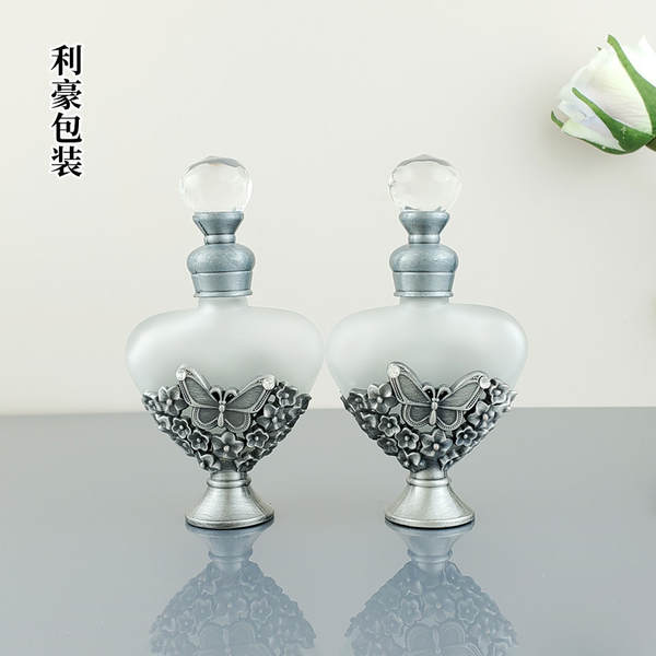 Venda por atacado no Oriente Médio Dubai Frasco de perfume de metal antigo de alta qualidade Frasco de perfume 12ml de óleo essencial de vidro distribuído em garrafas vazias